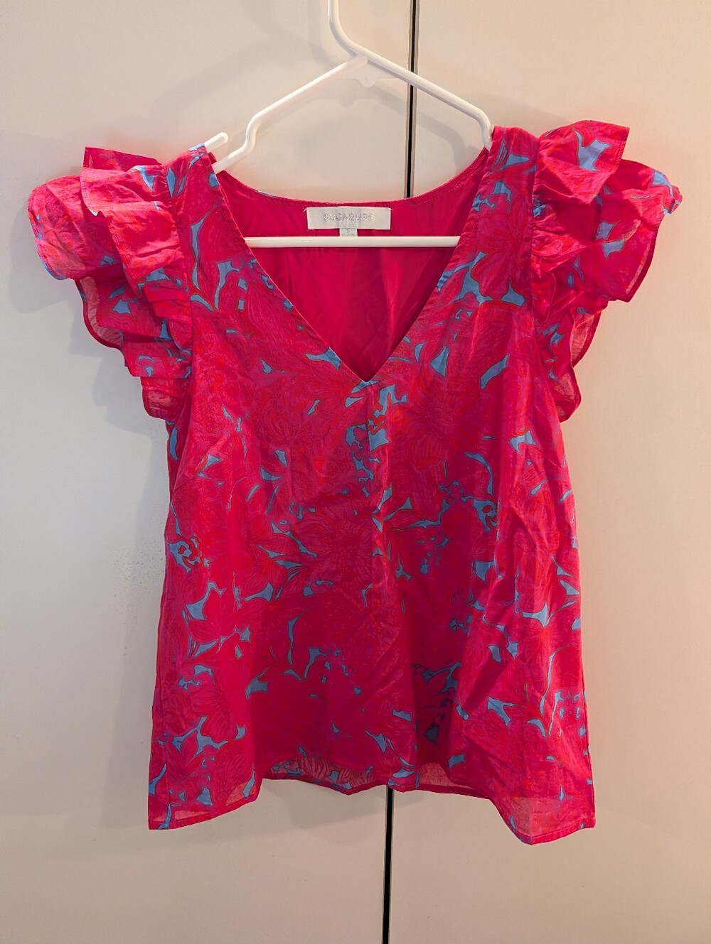 Sugarlips Sleeveless Ruffle V-Neck Top in Pink with Blue Print